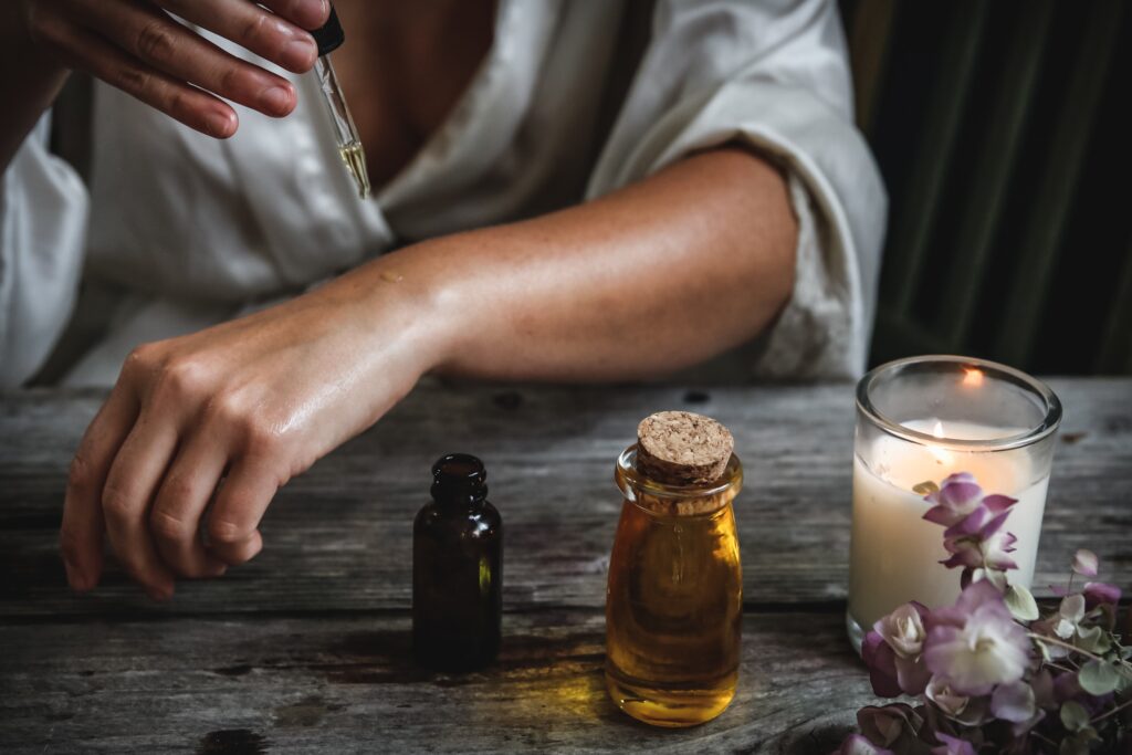 Person applying essential oils to wrist