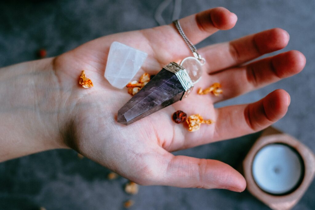 Hand holding various crystals